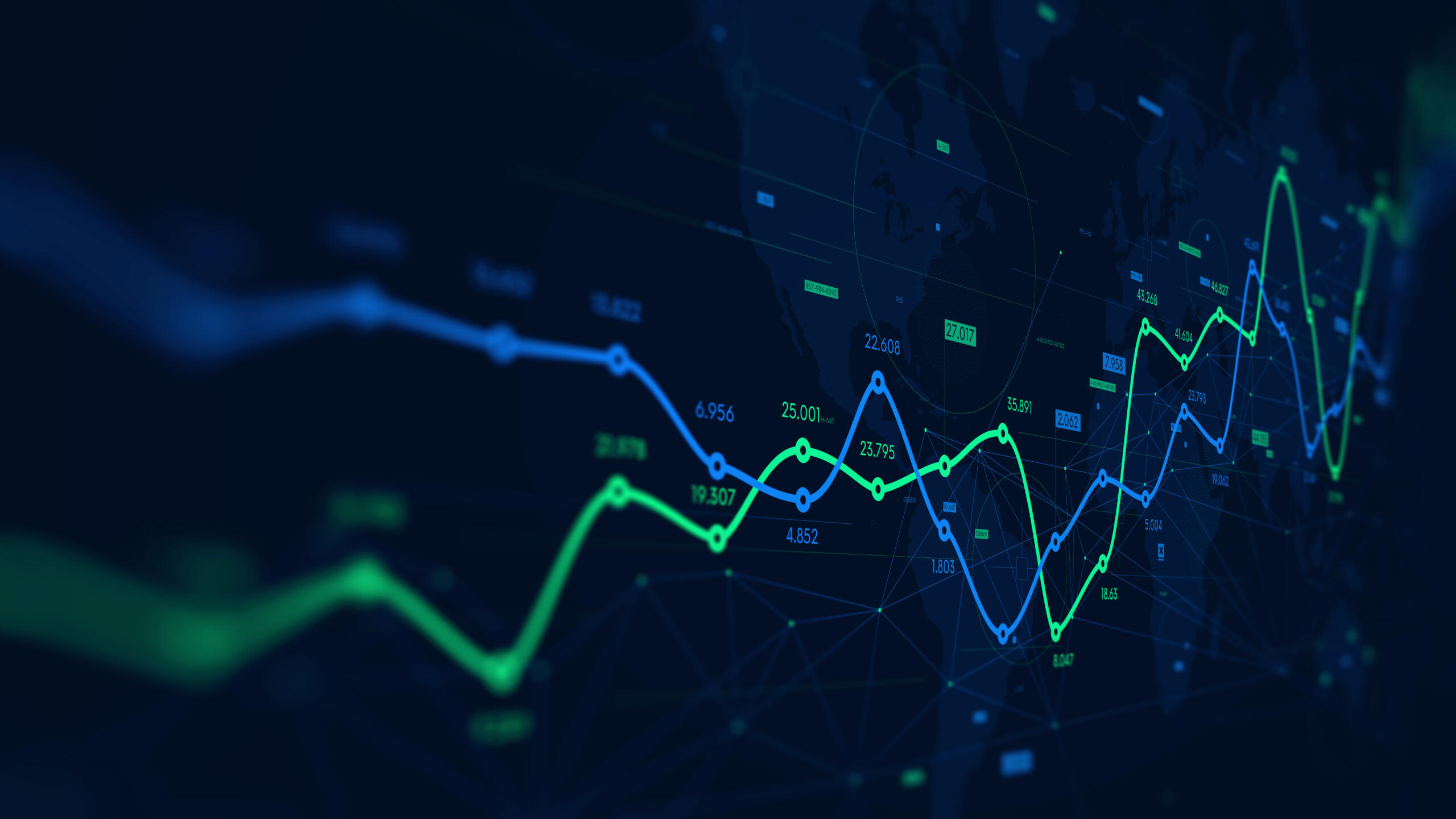 Digital stock market trends in blue and green displayed on a black background.
